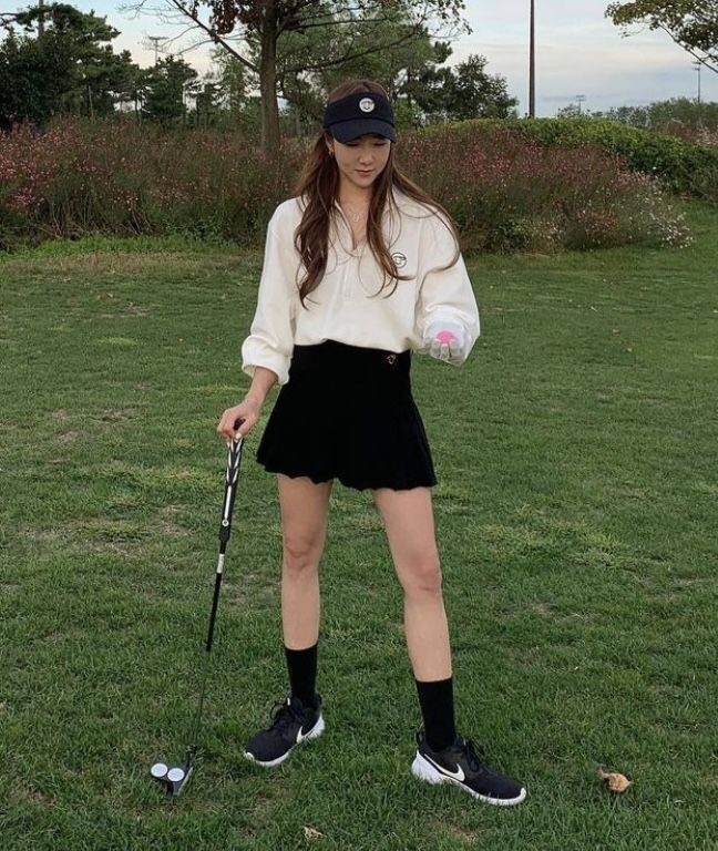 Cream Sweater with Black Skirt Elegance