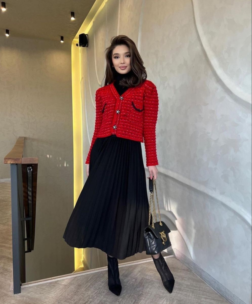 Red Tweed Jacket with Pleated Black Skirt
